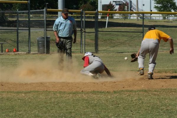 Past ball allows Schwager to slide past close play at plate